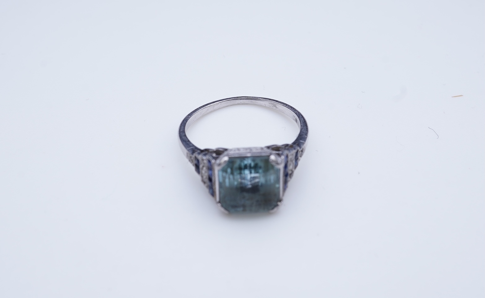 An aquamarine, sapphire and diamond ring
